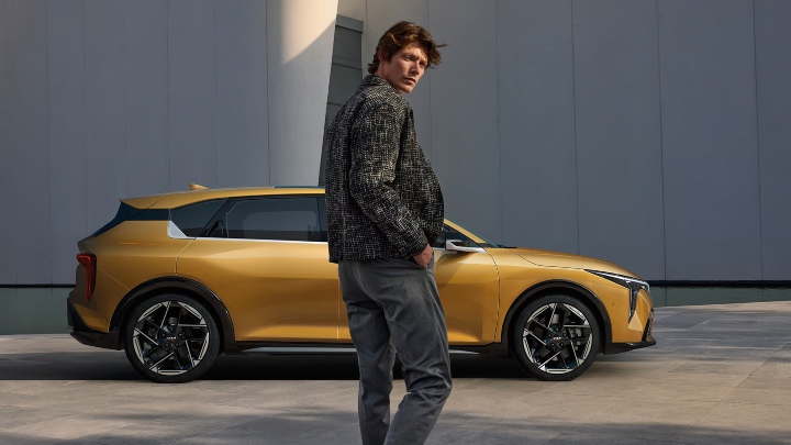 Yellow Kia K4 Exterior Side Static with Male