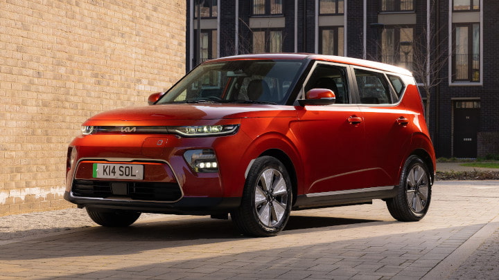 Red Kia Soul EV Parked On Road