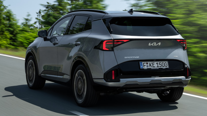 Kia Sportage HEV Driving Rear Angle in Silver