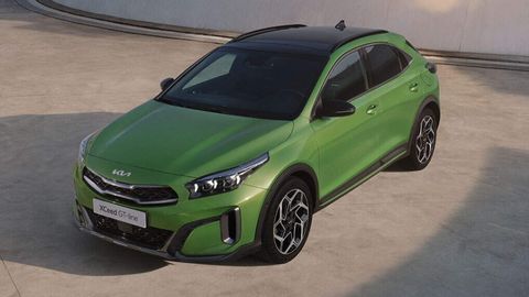 Green Kia Xceed parked on a grey floor