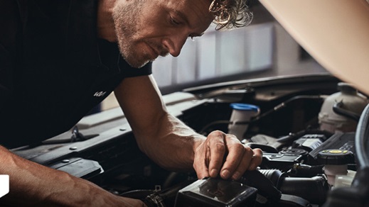 Technician Working on Car