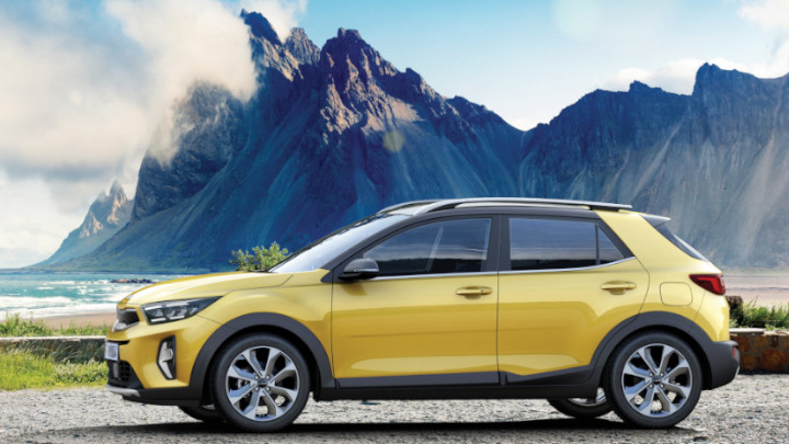Kia Stonic in Yellow Next to Mountain