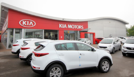 Outside a Kia dealership