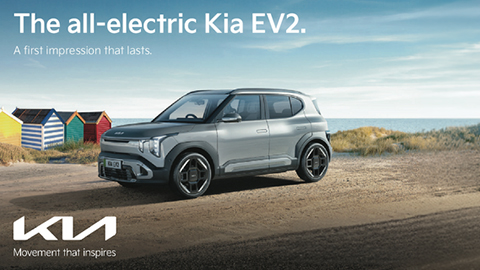 Grey Kia EV2 Parked By A Beach