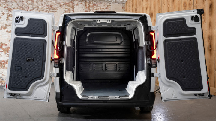 Kia PV5 Cargo in White Parked Rear Doors Open