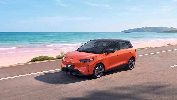 Leapmotor B03 orange driving near ocean