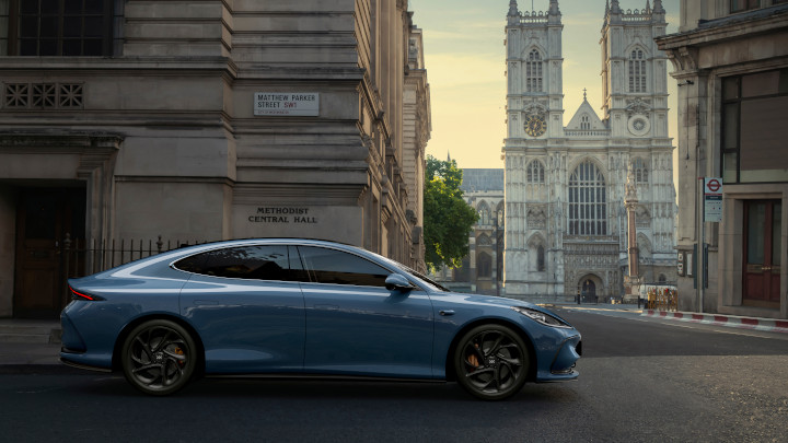 Nevis Blue MG IM5 Driving On City Street