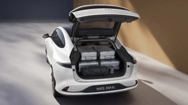 Rear Of White MG IM6 With Luggage Inside Open Boot