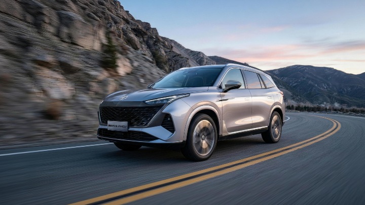Silver MGS9 Exterior Front Driving at Sunrise on Mountain Road