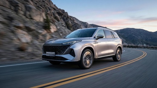 Silver MGS9 Exterior Front Driving at Sunrise on Mountain Road
