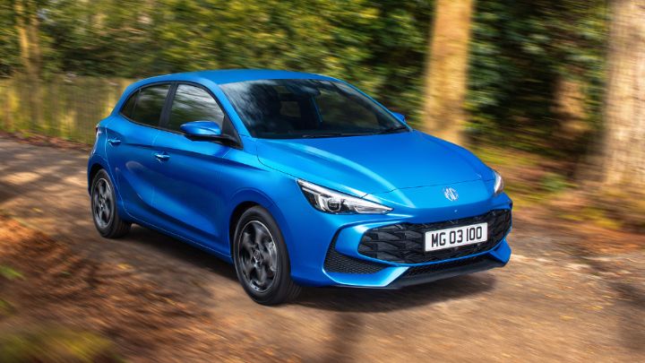 Blue MG3 Hybrid+ driving in the woods
