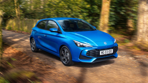 Blue MG3 Hybrid+ driving in the woods