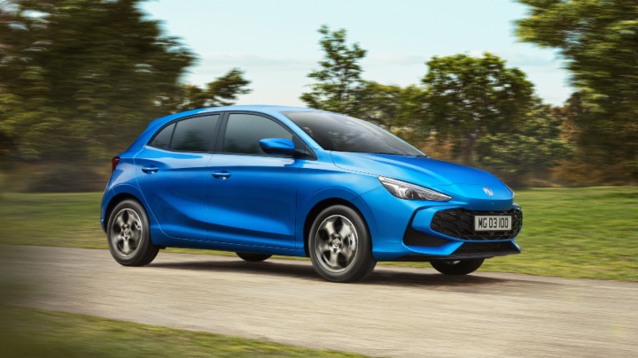Blue MG3 Exterior Front Driving through Forest Track