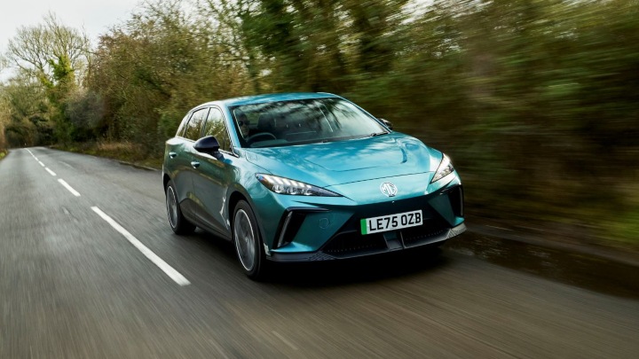 Blue MG4 EV Exterior Front Driving in Countryside