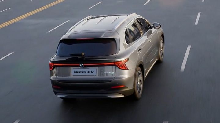 View of the rear end of an MGS5 EV driving on a paved road