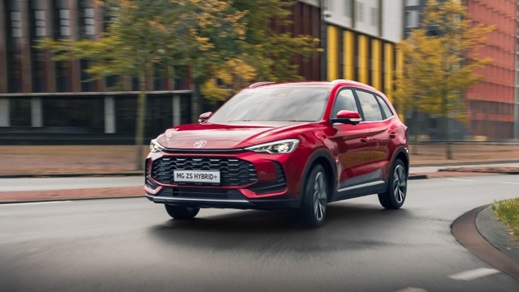 Red MG ZS Hybrid+ Exterior Front Driving in Urban Environment