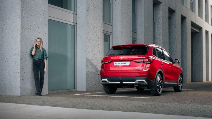 Red MG ZS Hybrid+ Rear Static with Woman on Phone