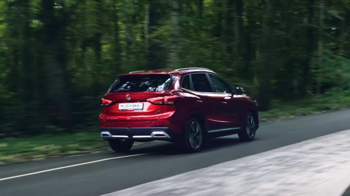 MG ZS Hybrid+ Exterior Rear Driving in Forest Area