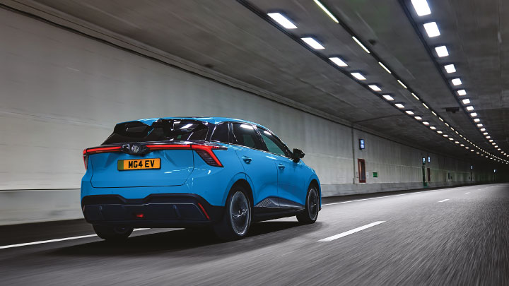 Rear Shot of Blue MG4 EV Driving Through Tunnel