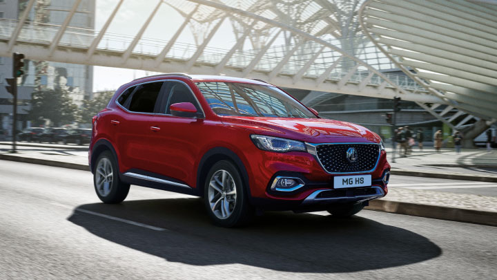 Red MG HS Driving On Road Front Shot