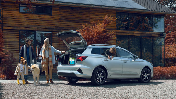 Family Loading the Boot of Silver MG5 EV