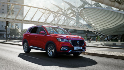 Red MG HS Driving On Road Front Shot