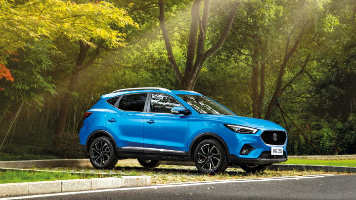 Blue MG ZS Parked In Grassy Area