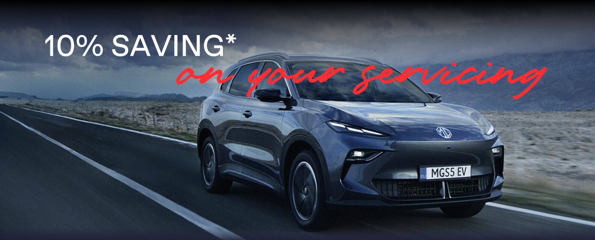 Grey MG driving on the road