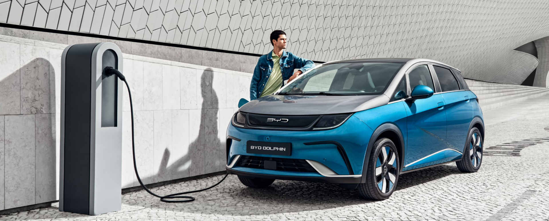 Blue BYD Dolphin Charging On Roadside