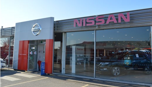 Outside the Nissan Dealership