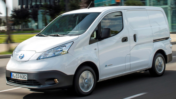 White Nissan e-NV200 Exterior Front Driving in Urban Area