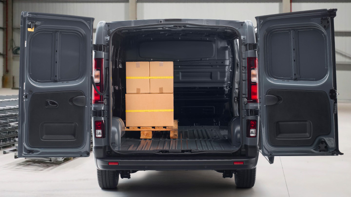 Nissan Primastar, rear cargo doors open with cargo loaded in the rear
