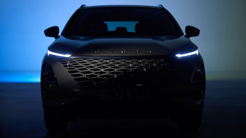 OMODA 5 in Dark Studio With Headlights On