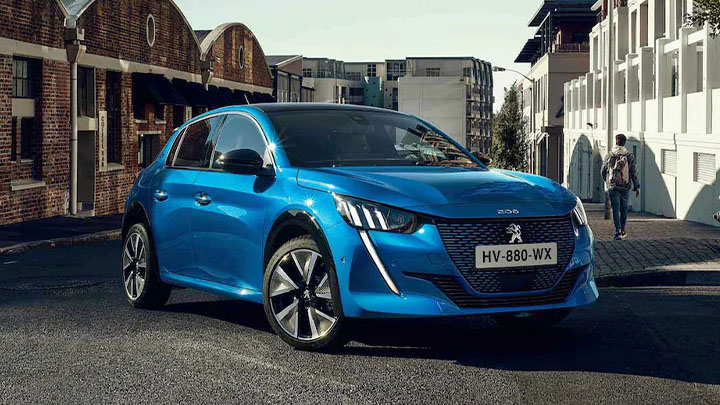 Blue Peugeot 208, parked with city background