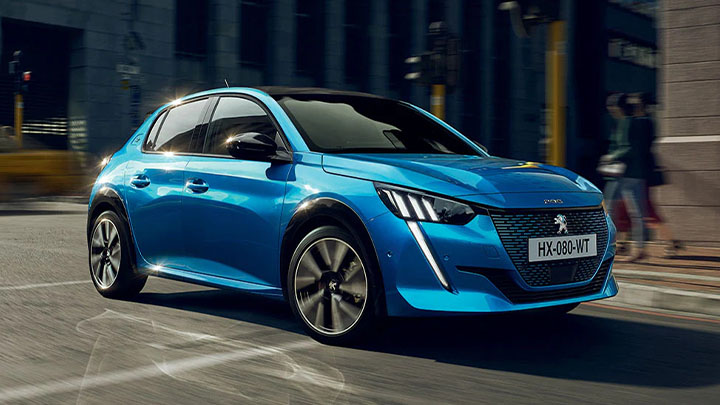 Blue Peugeot 208, driving shot