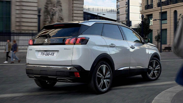 White Peugeot 3008, rear driving shot