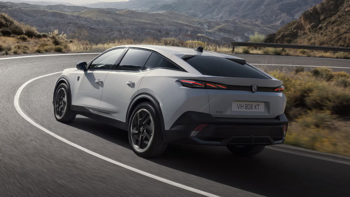 White Peugeot e-408 Rear Driving