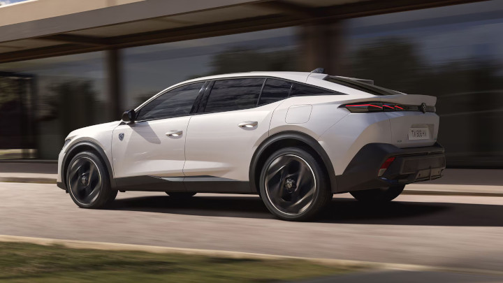 White Peugeot 408 Plug-in Hybrid Side Driving