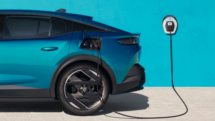 Blue Peugeot e-408 Charging
