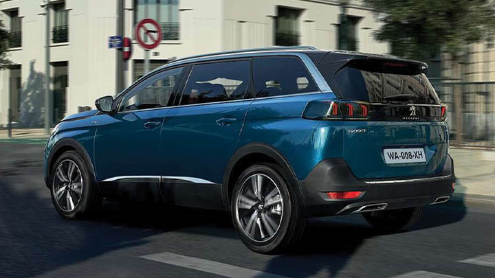 Blue Peugeot 5008, rear quarter driving shot