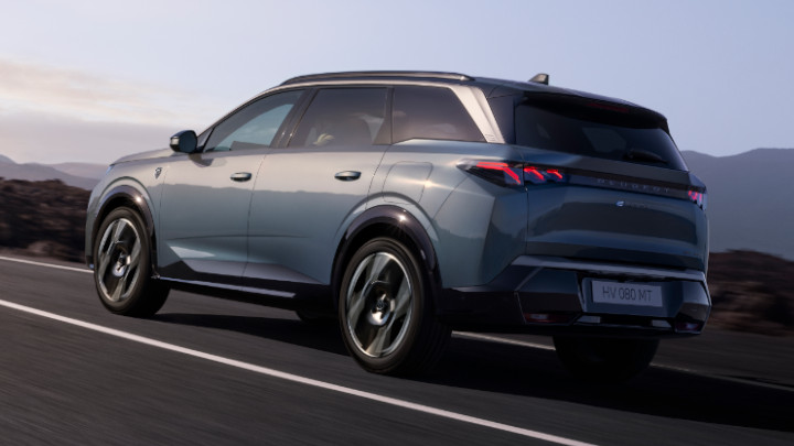 Peugeot E-5008 Dual Motor Finished in Ingaro Blue Driving on Road Rear Angle