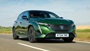 Green Peugeot 308 Driving