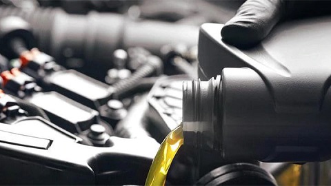 peugeot engine oil being topped up