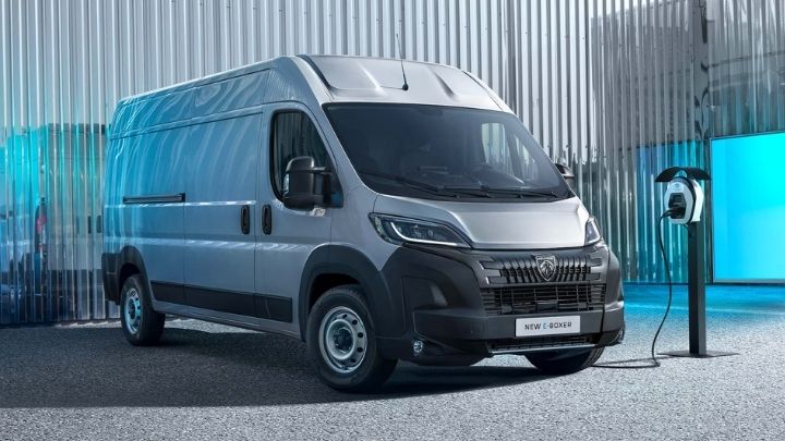 Peugeot E-Boxer parked in front of a metal wall whilst being charged