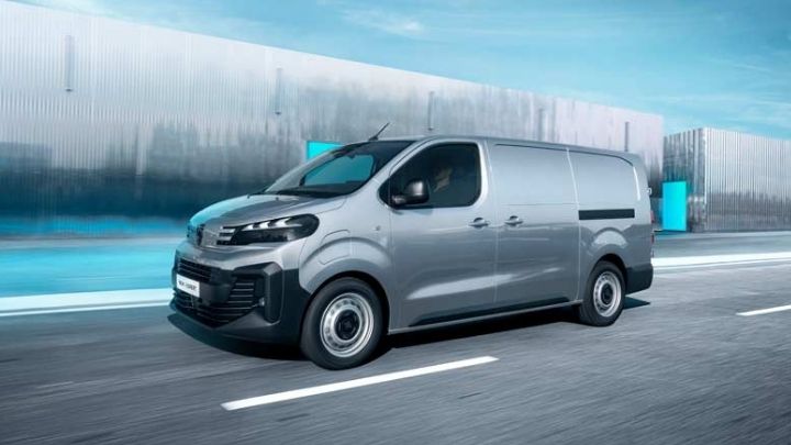 Silver Peugeot e-Expert driving on the road