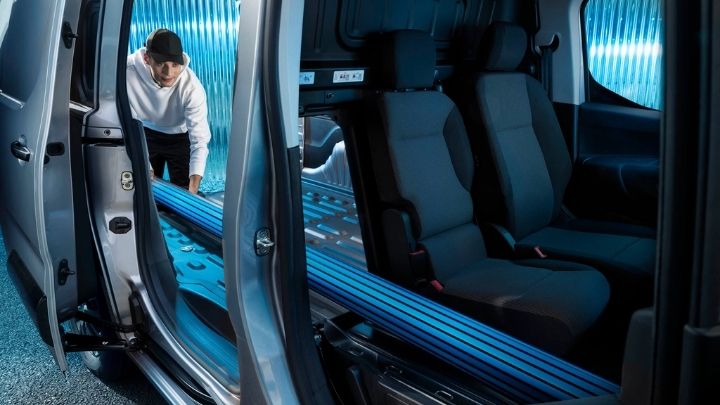 Man loading a Peugeot Partner