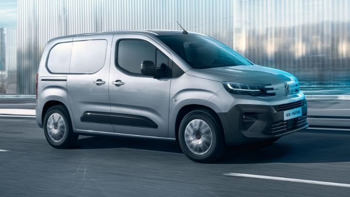 Side view of a silver e-Partner driving on the road