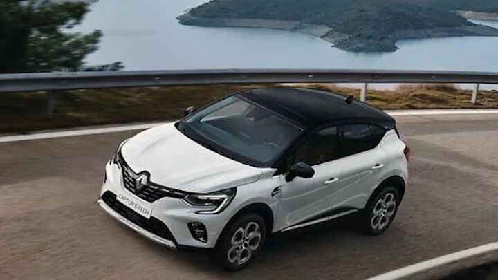 White Renault Captur E-Tech Plug-in Hybrid Driving