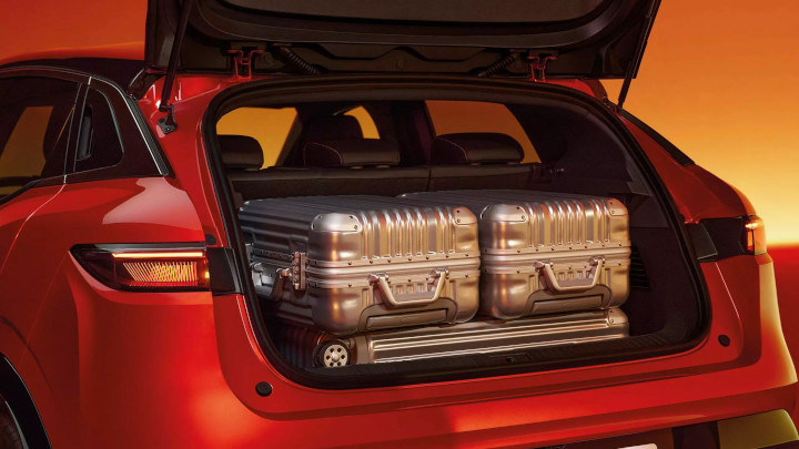 Flame Red Renault Megane E-Tech Rear Shot With Boot Open and Luggage Inside