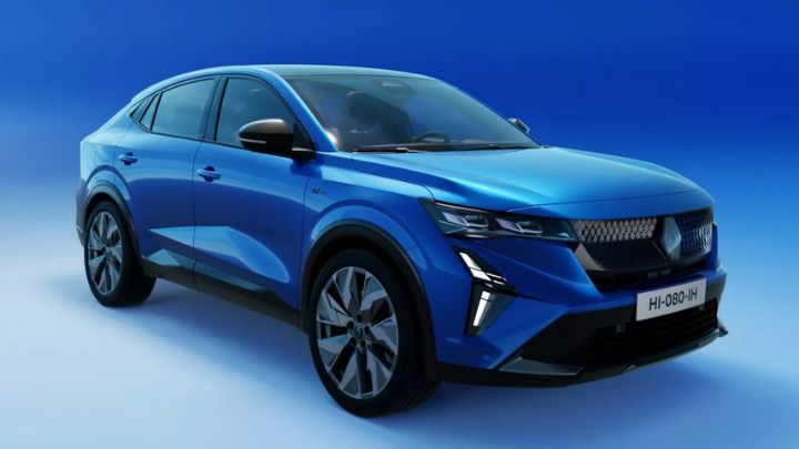 Blue Renault Rafale parked in a blue background